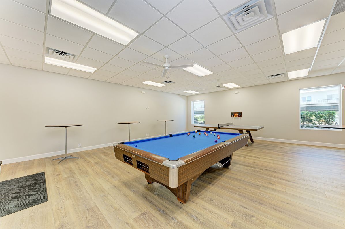 Community Room with billiards table and bar-height seating