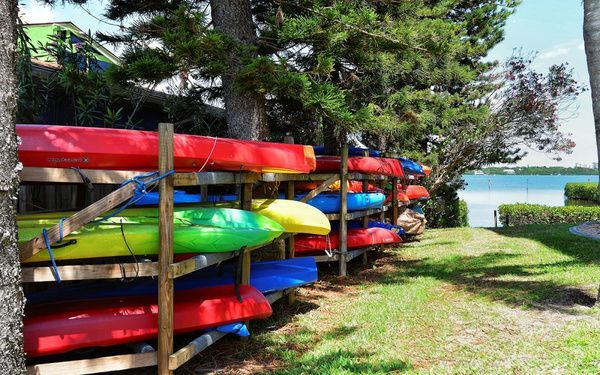Colorful kayaks on the Sunrise Cove kayak storage racks